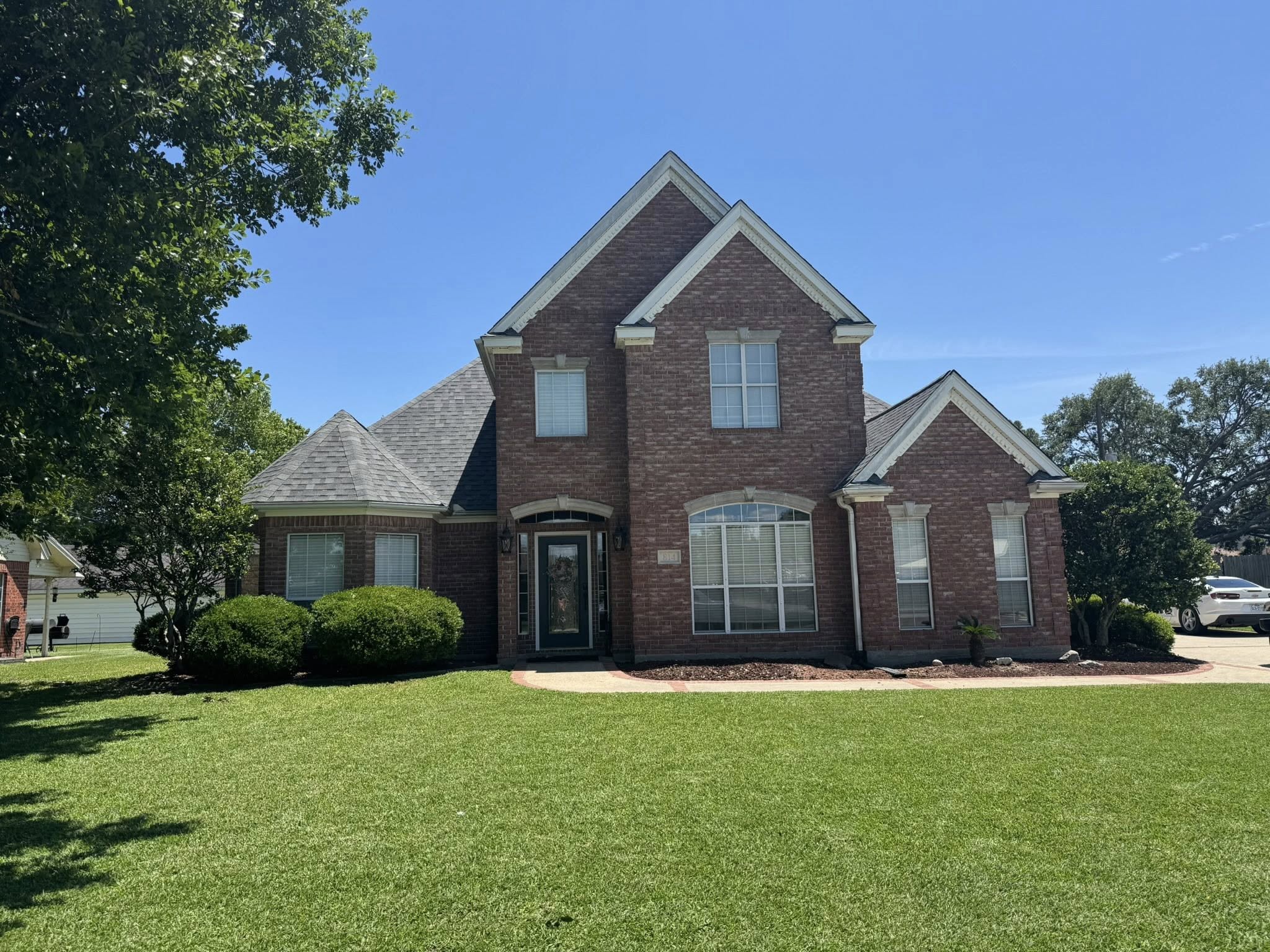 Residential roof and brick exterior